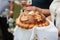 A festive loaf of bread. A product for traditional ceremonies. Decorated with flowers made of dough and salt shaker with