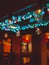 Festive luminous incandescent colored lamps hanging in evening twilight in form of garland on wires