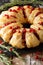 Festive meal: pie with meat, cranberry, rosemary and cheese close-up. vertical