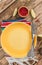 Festive Mexican table setting. Plate and cutlery with colorful napkin on rustic wooden background. Flat lay