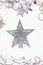 Festive mood, preparation for the holiday. New Year\\\'s festive decor in silvery colors, with a silver star in the center of the