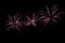 Festive multicolored fireworks on black background