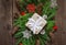 Festive natural decorated Christmas gift boxes. Coniferous branches and cones. Old boards. Top view.