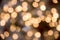 Festive New-year background with bokeh from Christmas tree lights glowing. Blurred colorful circles on light holiday