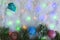 Festive New Year background green hood artificial snow and colored lights with fir branches.