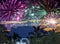 Festive New Years fireworks over the sea and mountains on tropical island