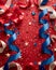 Festive Patriotic Background with Blue Ribbons and Red and White Confetti on Crimson backdrop for Holidays