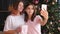Festive photoshoot happy sisters smartphone