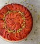 Festive Quince tart tatin, beautiful and delicious  dessert for the Holidays, garnished with green pistachios