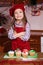 Festive red apron Christmas party dinner dessert peppermint cupcakes cheese cream sugar sprinkling decoration girl new