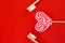 Festive red background. Sweet heart candy. And two toothbrushes symbol of love. Valentine\\\'s Day. Ideas of gifts. Flat lay