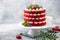 Festive  Red Velvet cake on white cake stand