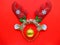 Festive reindeer muzzle with shiny horns and Christmas ball