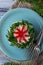 Festive salad decorated parsley and flower of pepper