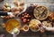 A festive set table with abundant food, pies, eggs, homemade cakes and cutlets.Hands of guests over the table. Meeting friends