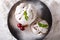 Festive shortbread cookie snowball with mint and cherry on a plate. Horizontal top view