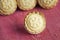 Festive shortcrust pastry mince pies. A sweet mince pie, a traditional rich festive food on red wooden background.