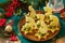 Festive snack of canapes on the Christmas table. Fruit canapes with cheese, kiwi and pineapple.