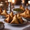 festive spirit of Ramadan in a Middle Eastern style room, where close up photography of samosas are served on the table for a warm