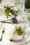 Festive spring table setting with pear blossom flowers