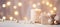 Festive still life with burning candles and Christmas decorations on bokeh background. Christmas composition for home interior