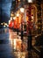 Festive street lamp wrapped in green and red Christmas lights, snowflakes falling, quaint town setting