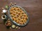 Festive sweet Ramadan background with homemade date cookies on a brown wooden table