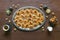 Festive sweet Ramadan background with homemade date cookies on a brown wooden table