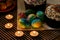 Festive table for Easter. There are two Easter cakes on the table, several Easter eggs are lying, candles are burning