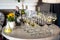 Festive table with glasses of wine, chilled bottles of wine