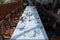 Festive table set with white cloth, plates, forks blue glasses and candlestick with white candles for wedding, family event