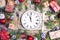 Festive table setting with dish clock and Christmas decorations