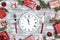 Festive table setting with dish clock and Christmas decorations