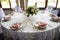 Festive table setting with wine glasses, and fresh flowers