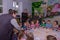 A festive tea party for children from large families, organized by a charity organization. Children are sitting at a festive table