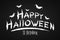 Festive text banner for Happy Halloween. Horrible grunge calligraphy with bats and spiders on a dark background. Vector