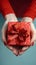 Festive touch Womans hands present a red gift with ribbon