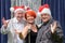 Festive trio or performers celebrating Christmas