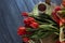 Festive tulips on wooden background