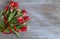 Festive tulips on wooden table