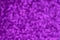 Festive violet pattern background. Holiday glowing party decoration. Magic illuminated lights