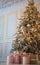 Festive winter holiday decorated Christmas tree with hanging toys garland cosiness home apartment