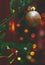 Festive winter holidays December time vertical soft focus picture with ball decorative object hanging on Christmas tree branch