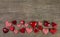 Festive wooden background with red white checked hearts for christmas, valentine or birthday cards.