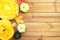 Festive wooden table with pumpkin pie, decorative pumpkins and maple leaves