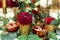 Festively decorated banquet table in the restaurant. Fresh flowers are golden candles and red chairs and garnet. expensively rich