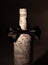 Festively decorated bottle of wine.isolated on a dark background