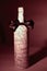 Festively decorated bottle of wine.isolated on a dark background
