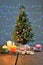 Festively decorated Christmas tree with candles and illumination