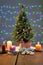 Festively decorated Christmas tree with candles and illumination